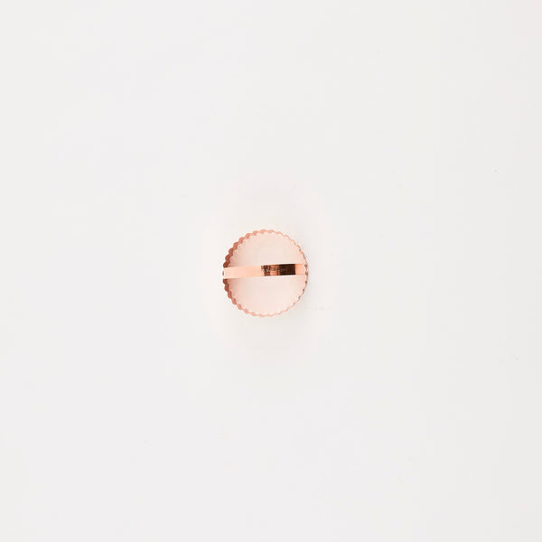 Rose gold circular cutter.