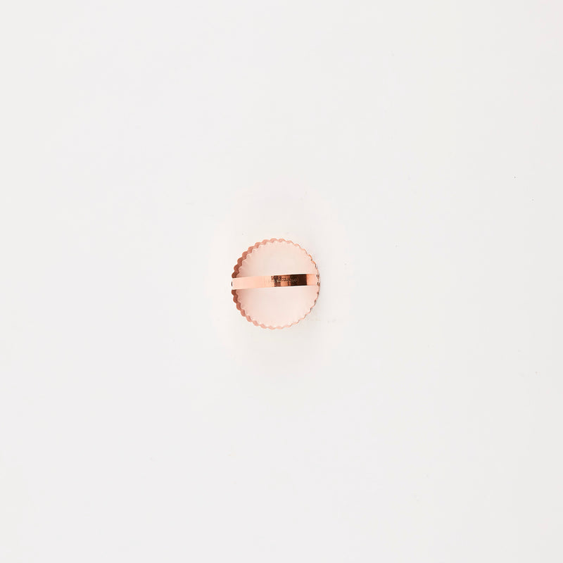 Rose gold circular cutter.