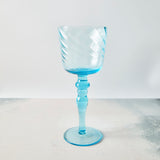 Cyan blue wine glass. 