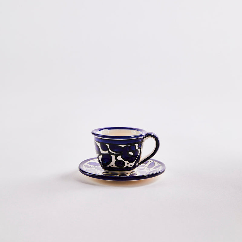 Blue with white decor espresso cup and saucer. 