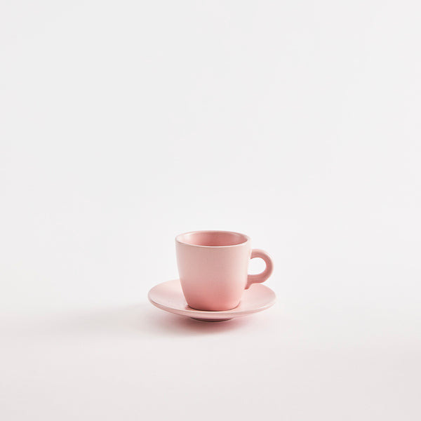 Pink espresso cup with saucer. 
