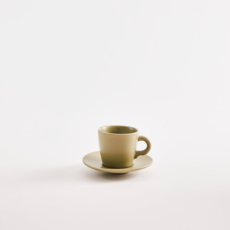 Green espresso cup with saucer. 