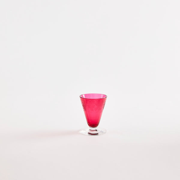 Pink glass tumbler with clear base.