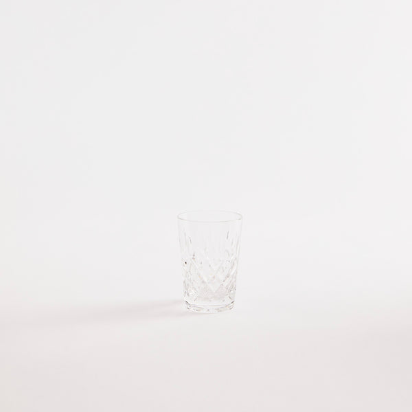 Clear glass tumbler with etched design.