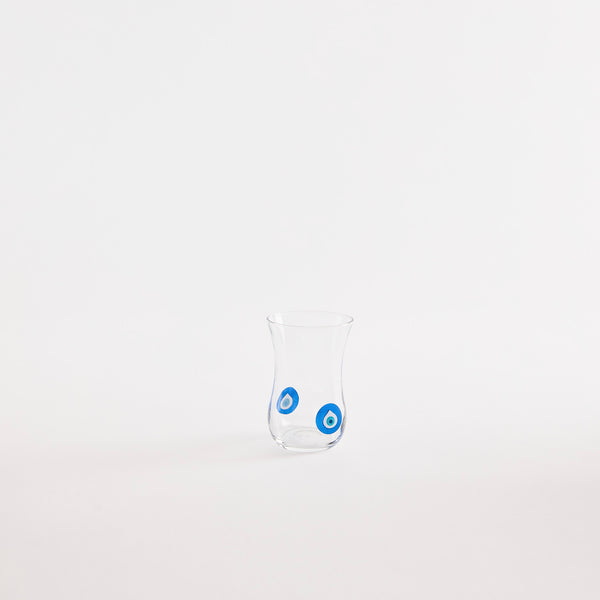 Clear glass tumbler with blue circle design.