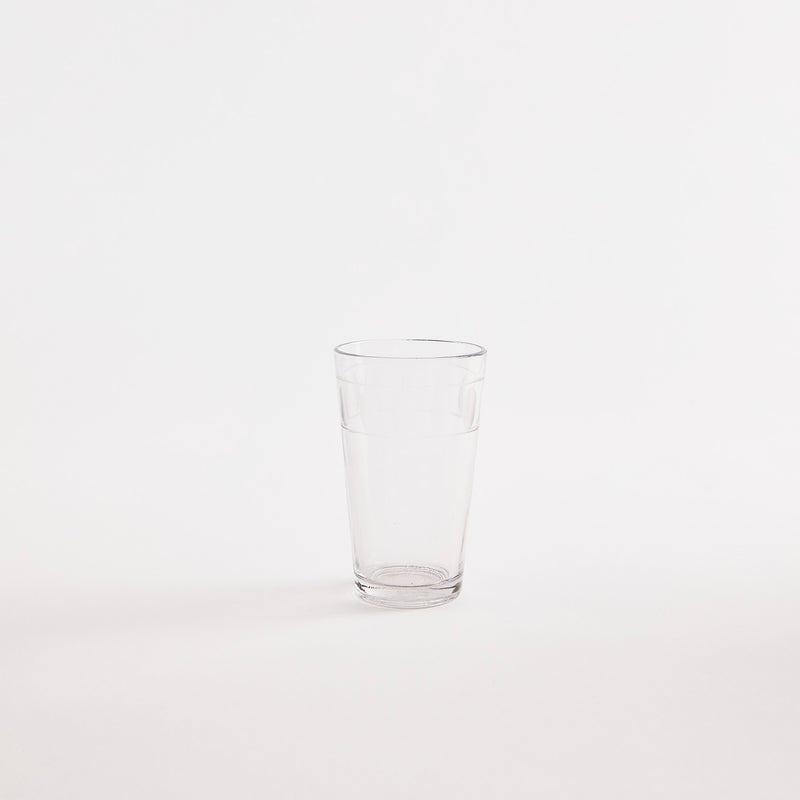 Clear glass tumbler.