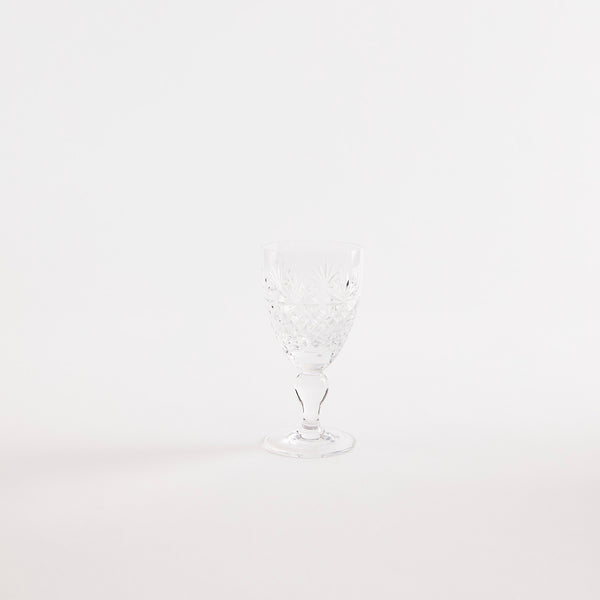 Clear glass goblet with etched design.