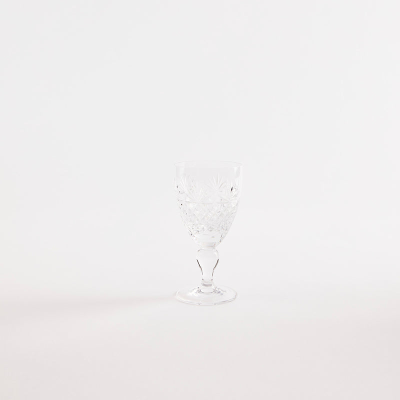 Clear glass goblet with etched design.