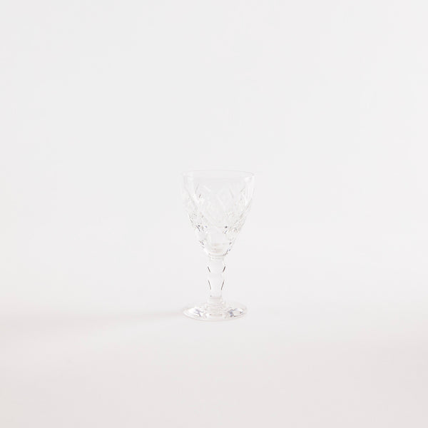 Clear glass goblet with etched design.