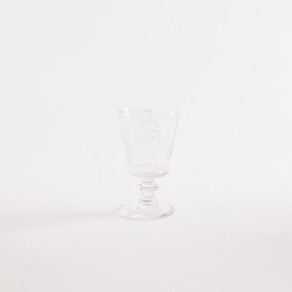 Clear glass goblet with embossed design.