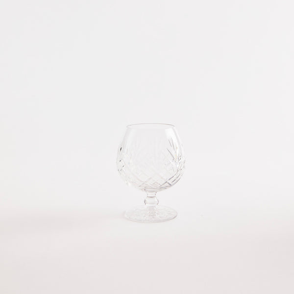 Clear wine glass with etched design.