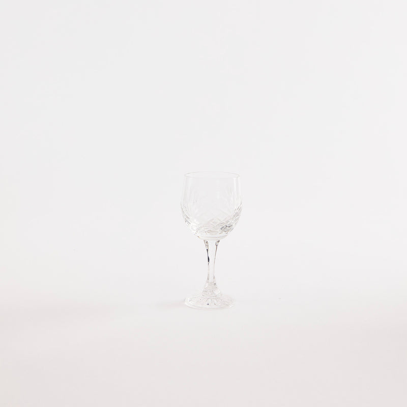 Clear glass goblet with etched design.