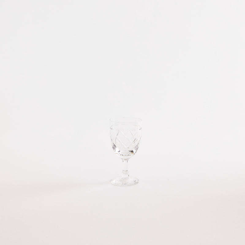Clear glass goblet with etched design.