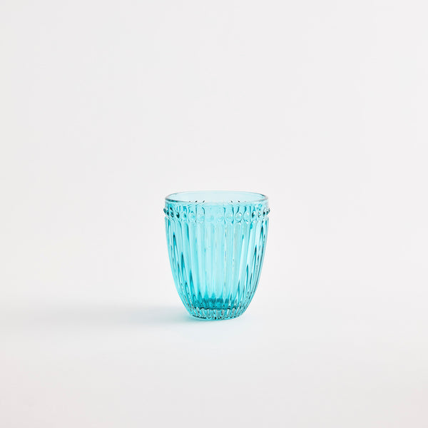 Turquoise glass tumbler with embossed design.