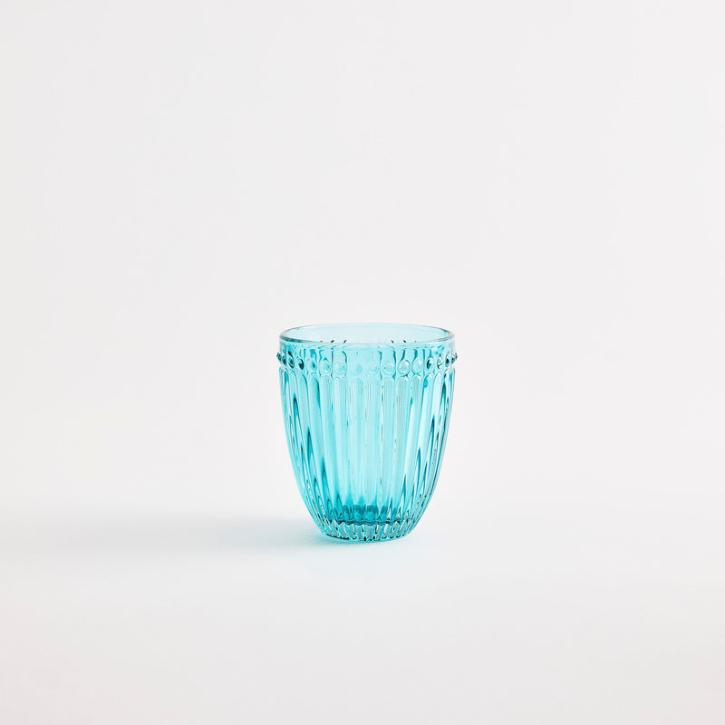 Turquoise glass tumbler with embossed design.