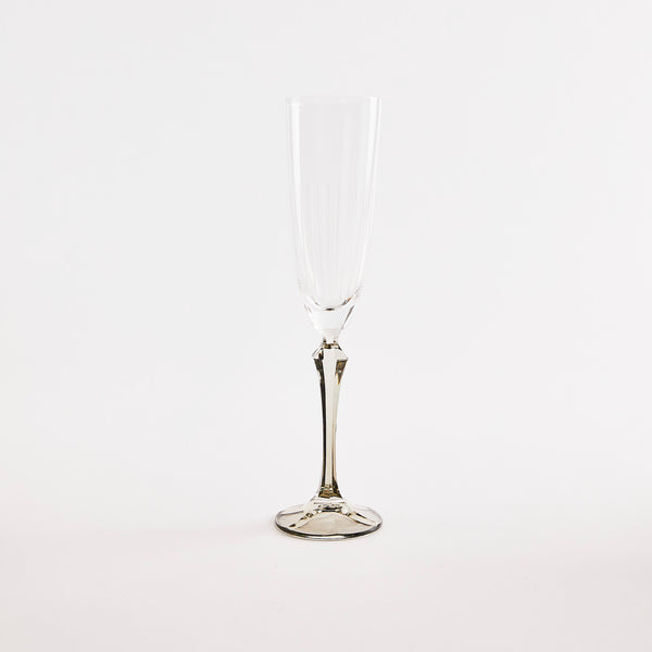 Clear champagne glass with grey base.