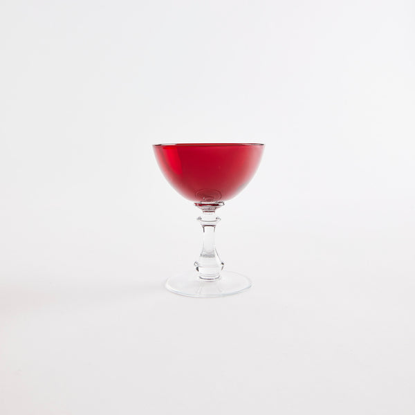 Red glass coupe with clear base.