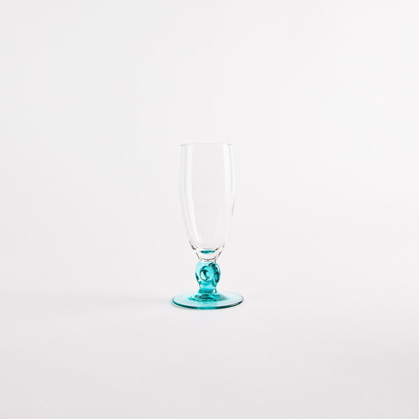 Clear glass with blue stem.