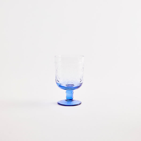 Clear glass goblet with blue base.
