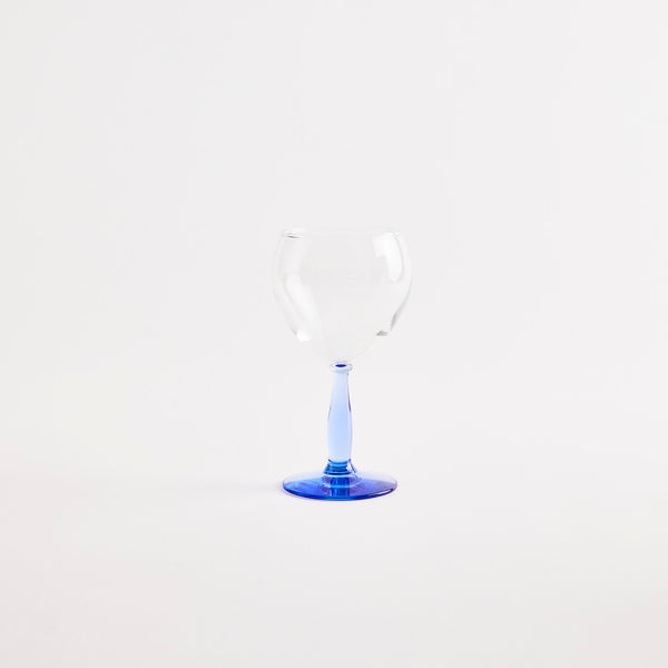 Clear wine glass with blue base.