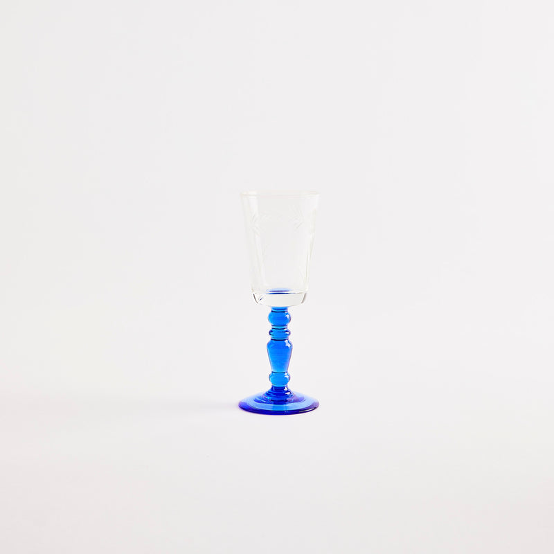 Clear flute glass with blue base.