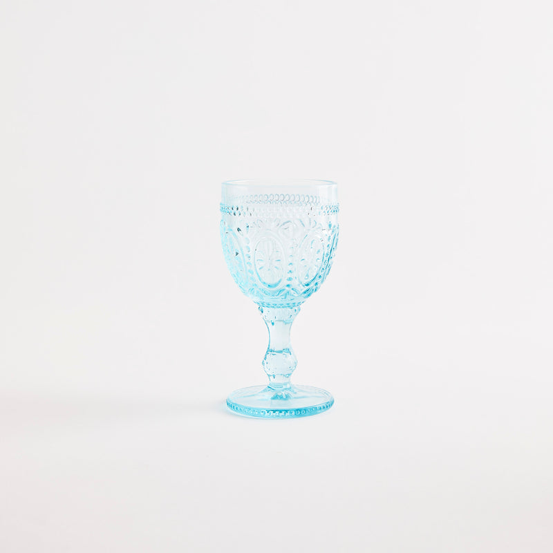 Blue glass goblet with embossed design.