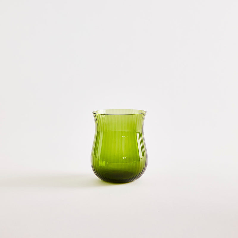 Green glass tumbler.