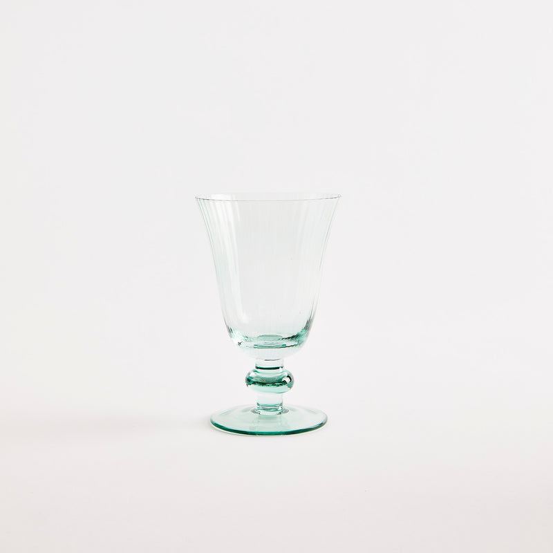 Green glass goblet.