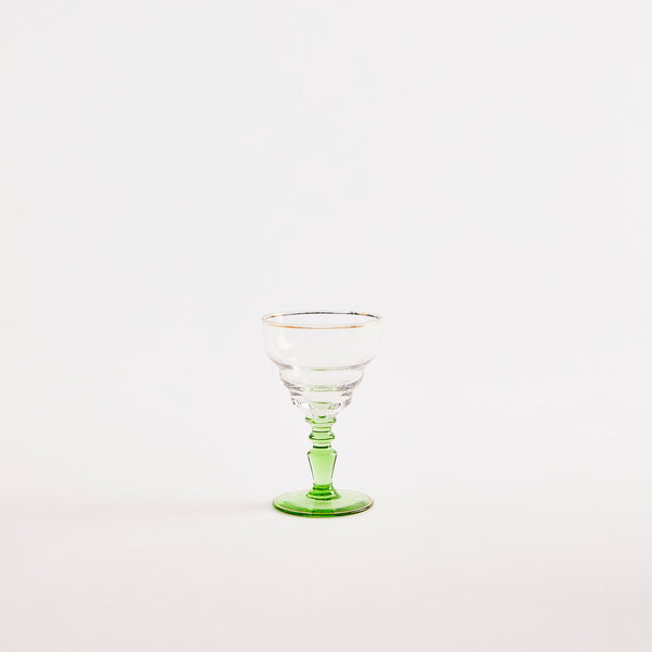 Clear goblet with green base.