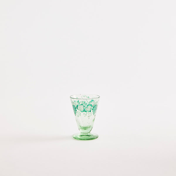 Green goblet with greenery design.