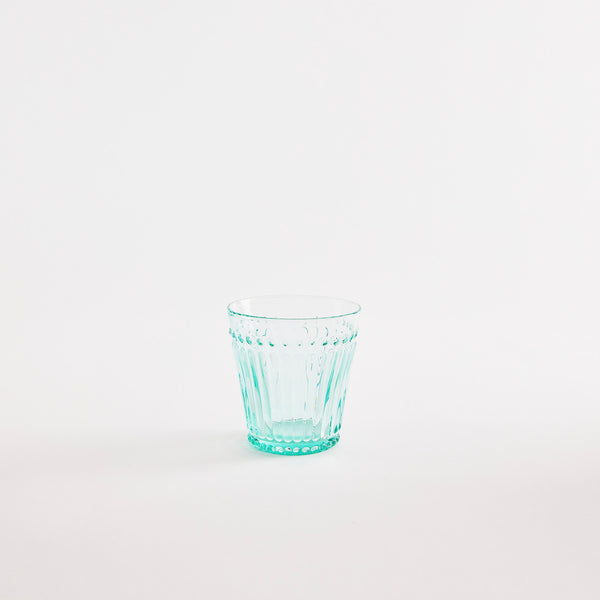 Blue glass tumbler with embossed design.