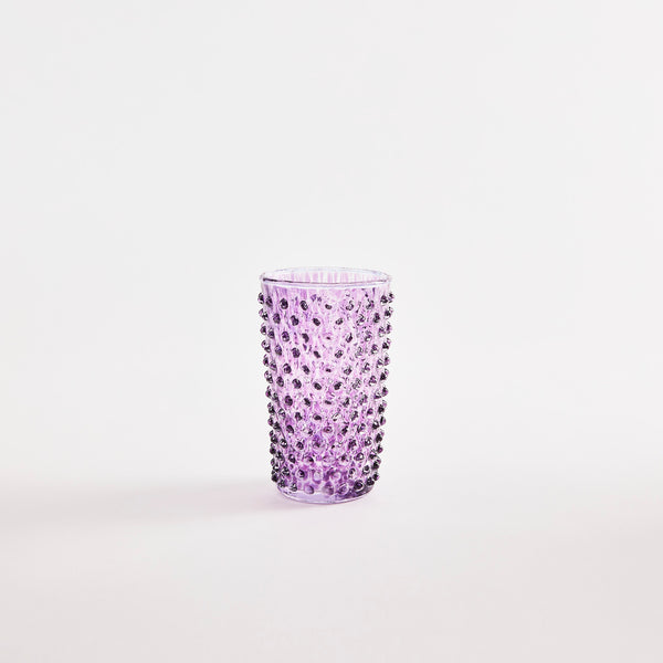 Purple glass tumbler with bubble embossed design.