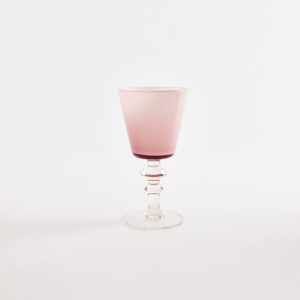 Pink glass goblet with clear base.