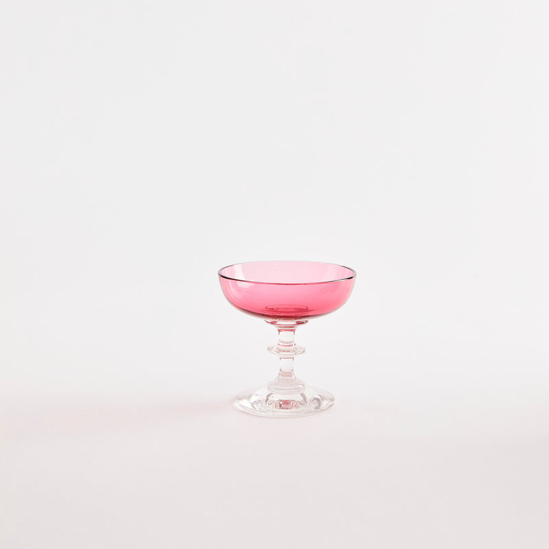 Pink glass dessert coupe with clear base.