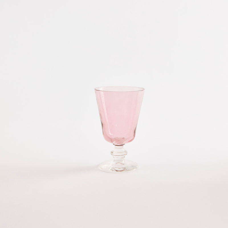 Pink glass with clear base.