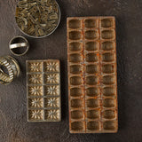 Top view of biscuit cutters on Industrial Brown Background. 