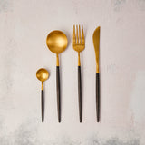 Gold with black handle cutlery.