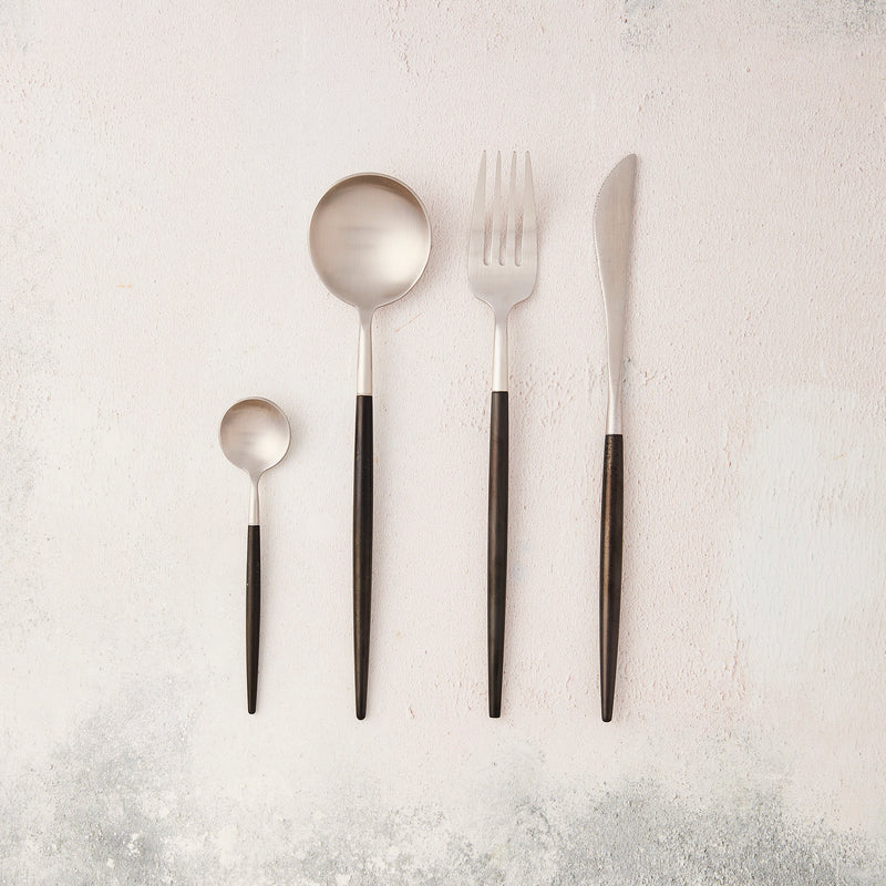 Silver with black handle cutlery.