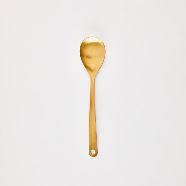 Gold kitchen spoon.