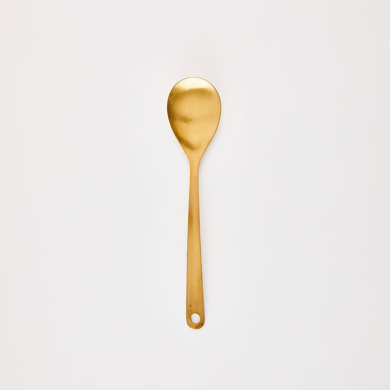 Gold kitchen spoon.