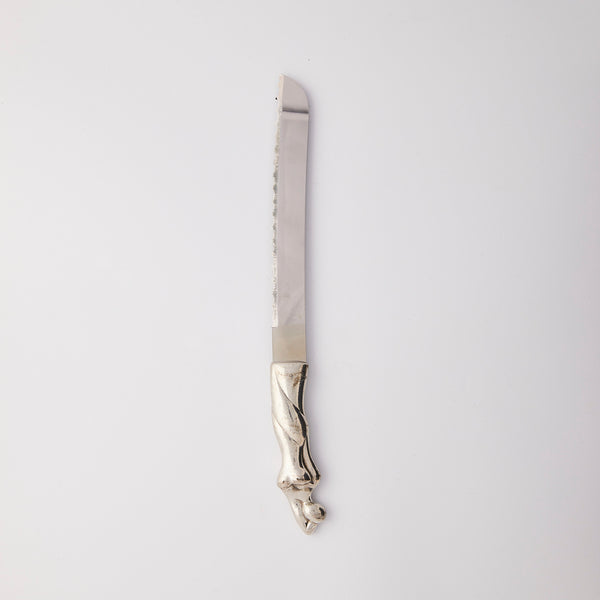 Silver knife with curved handle.