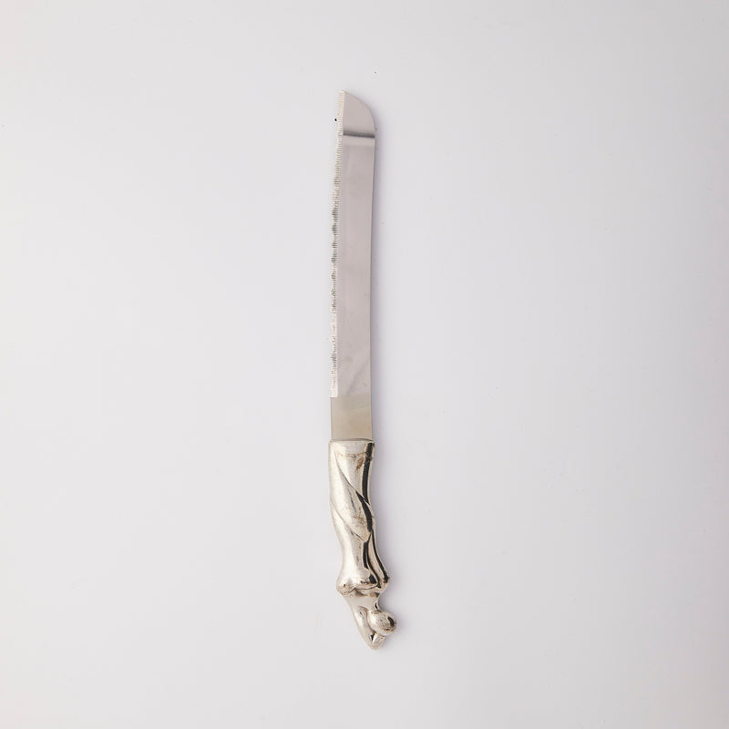 Silver knife with curved handle.