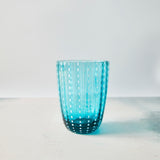 Blue with white dotted design glass tumbler.