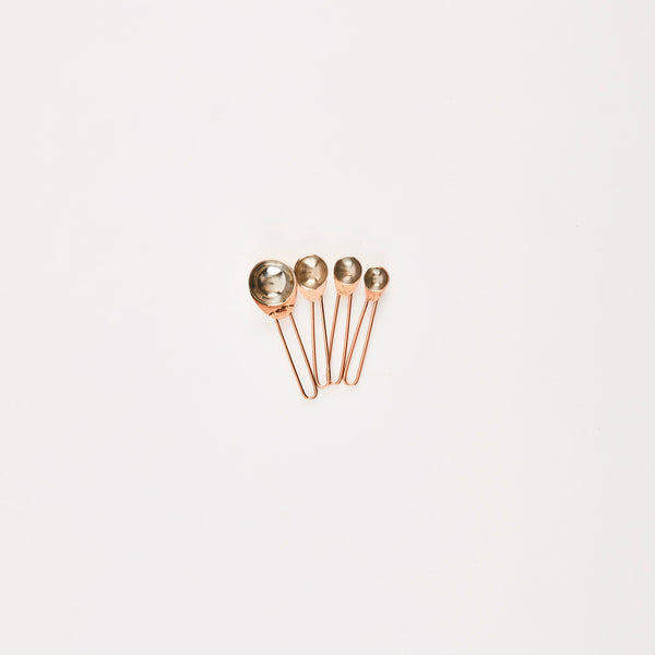 Rose gold measuring spoons.