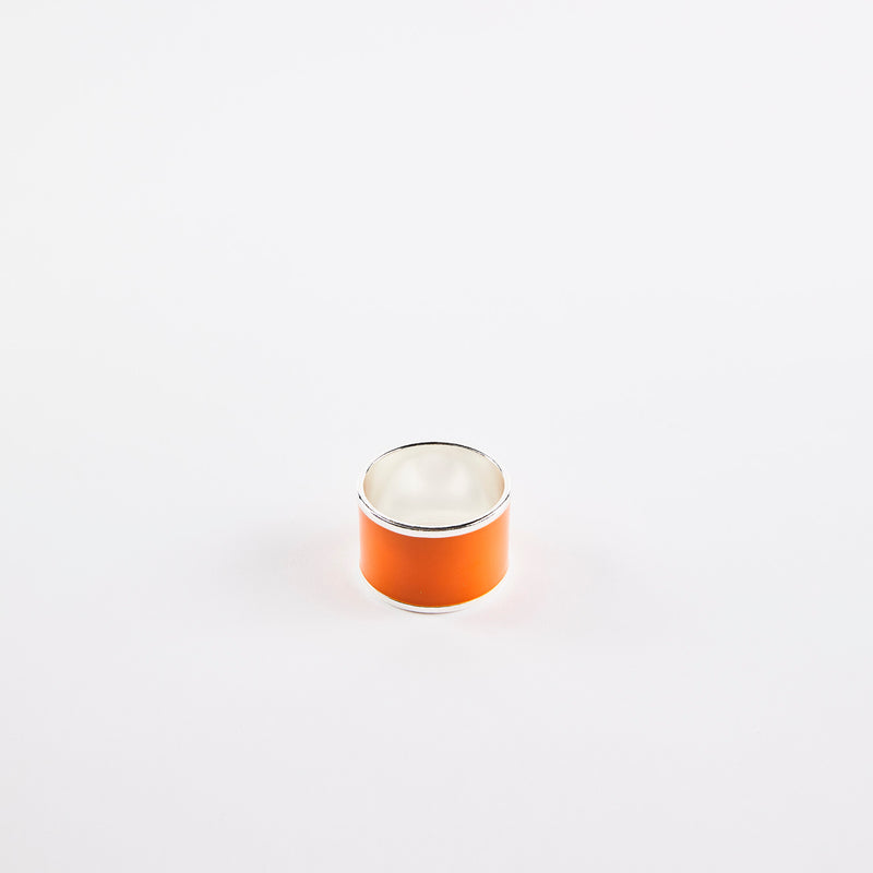 Orange napkin ring with silver inside and rim.
