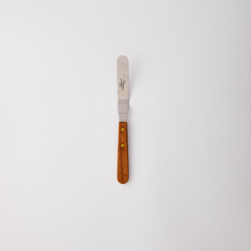 Silver palette knife with wood handle.