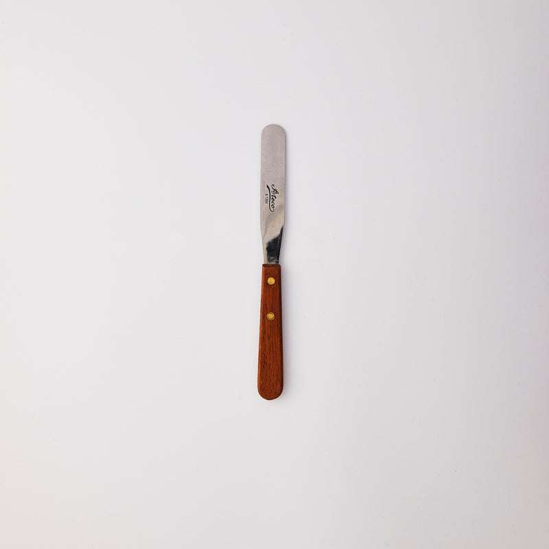 Silver palette knife with wood handle.