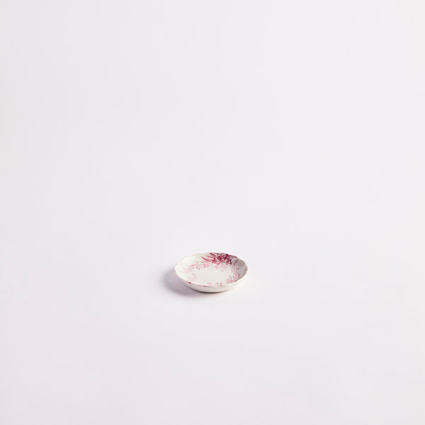 White with pink detailing pinch pot. 