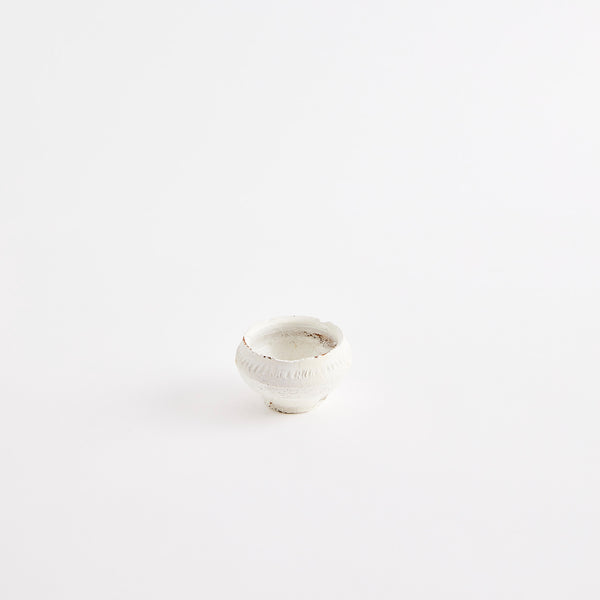 White pinch pot.