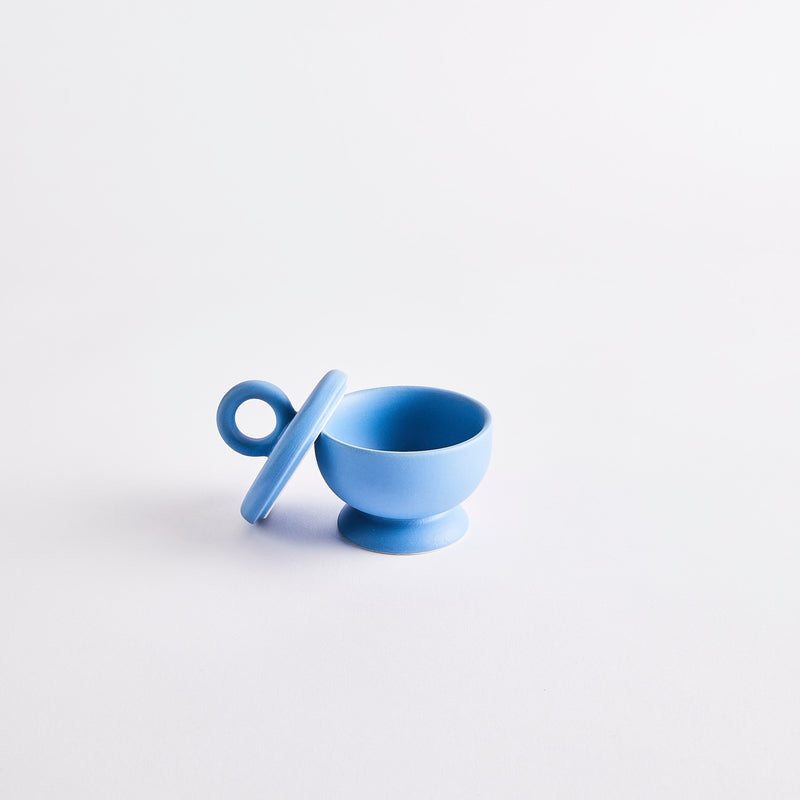 Blue pinch pot with lid.
